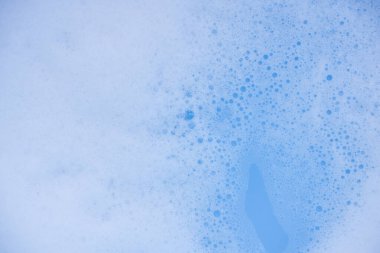 Soyut arka plan beyaz sabunlu köpük dokusu. Köpüklü şampuan köpüğü.