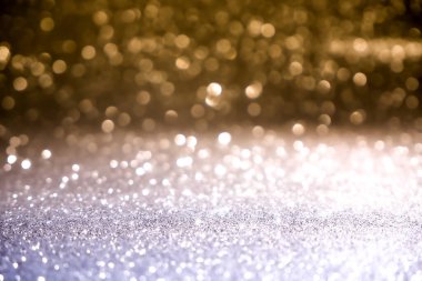 Bokeh 'te mavi ve sarı Noel arkaplan deseni soyut ışık parıldayan yıldızlar. simli klasik ışık arkaplanı