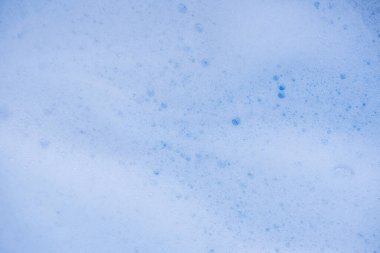 Soyut arka plan beyaz sabunlu köpük dokusu. Köpüklü şampuan köpüğü.