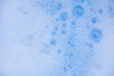 Soyut arka plan beyaz sabunlu köpük dokusu. Köpüklü şampuan köpüğü.