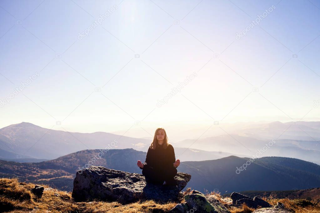 Girl Meditate on Mountain Peak