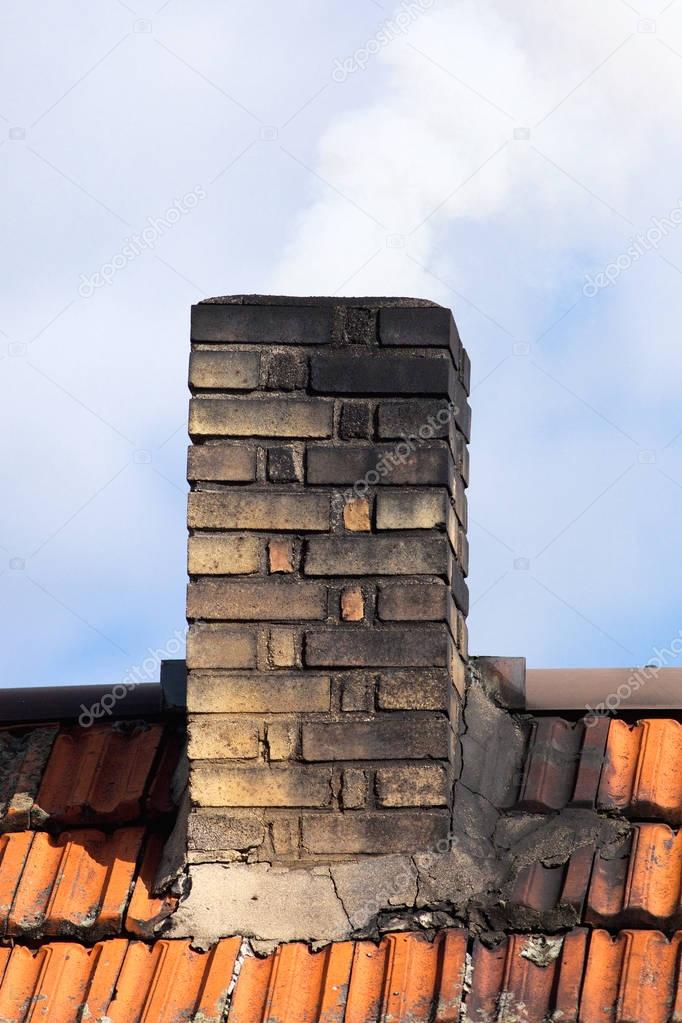 Smoking Chimney of an Old House 