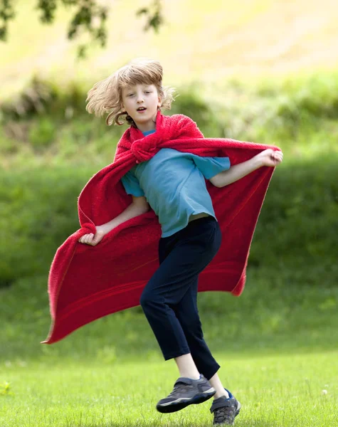Boy Running Around in Red Towel as Superhero Cloak — Stock Photo, Image