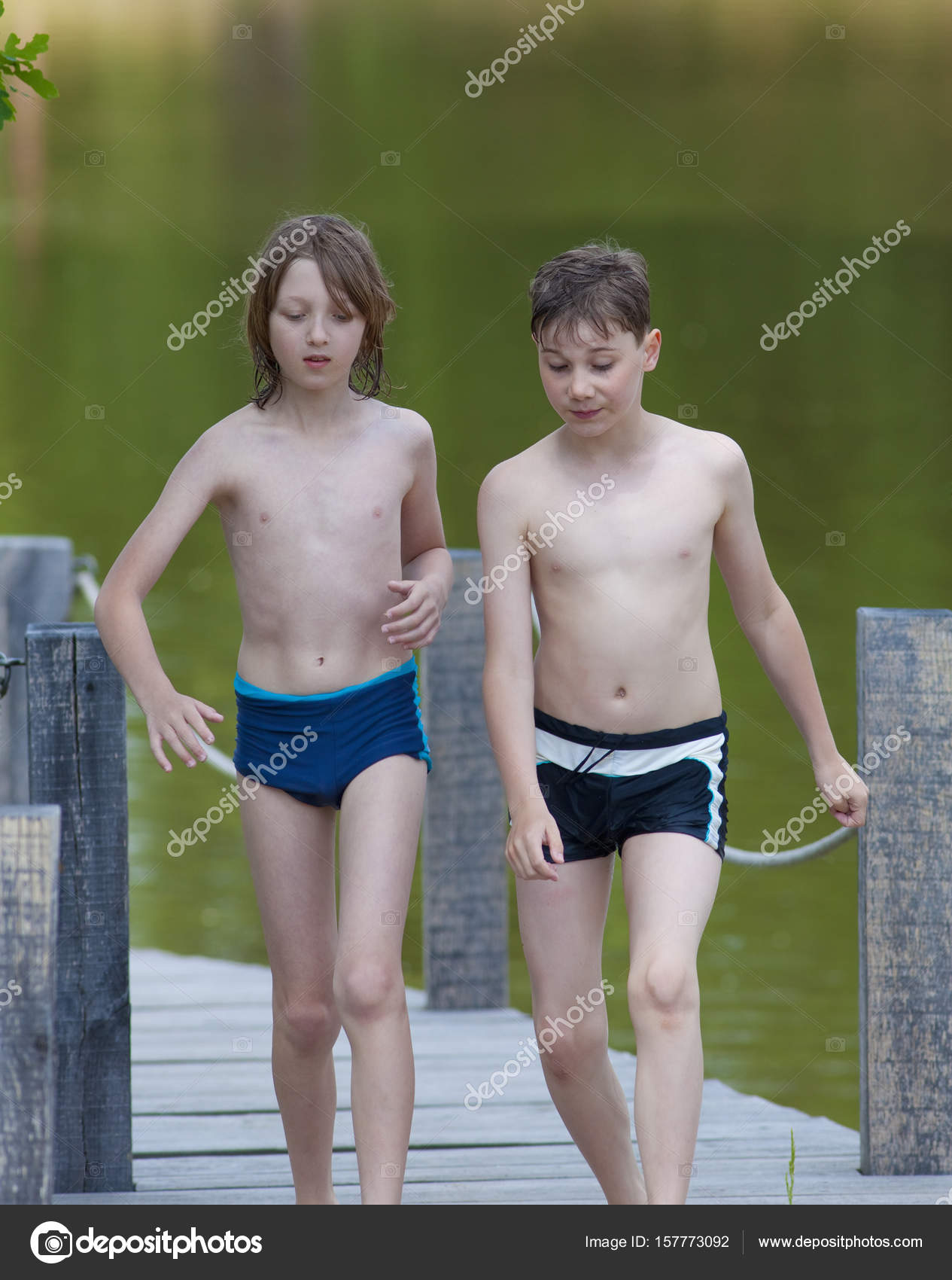 Two Boys Walking on Jetty — Stock Photo © courtyardpix #157773092