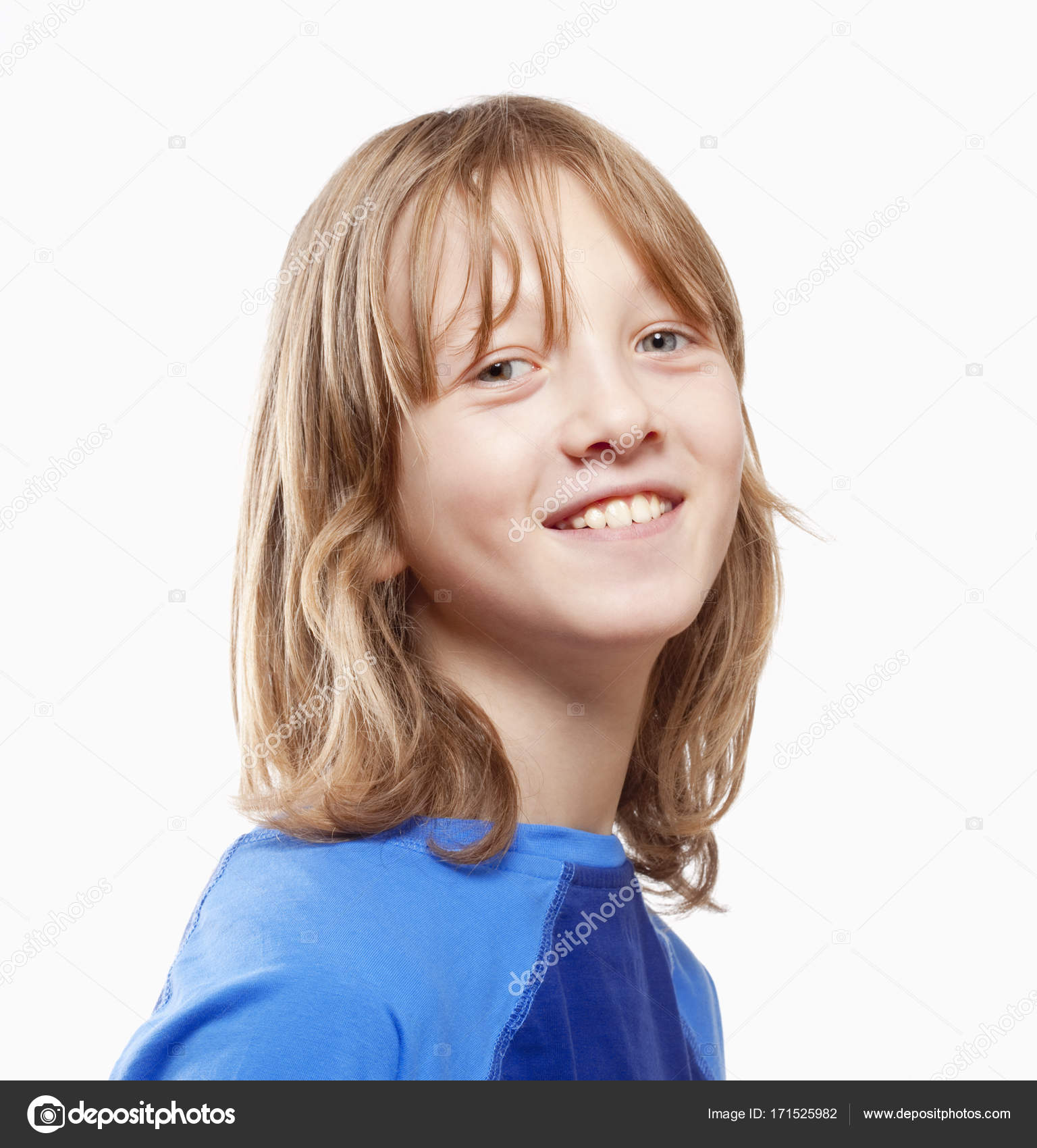Portrait Of A Boy With Long Blond Hair Smiling Stock Photo