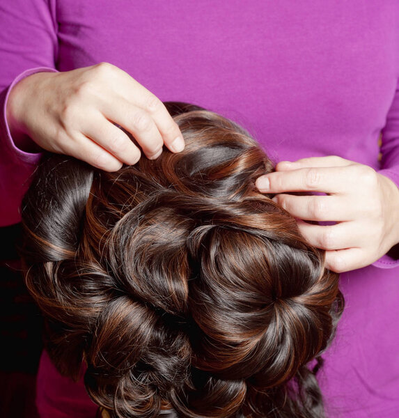 Professional Wig Maker Working in her Workshop.