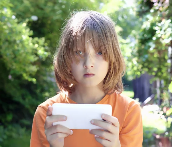 Boy with Blond Hair Looking at Mobile Phone — Stock Photo, Image