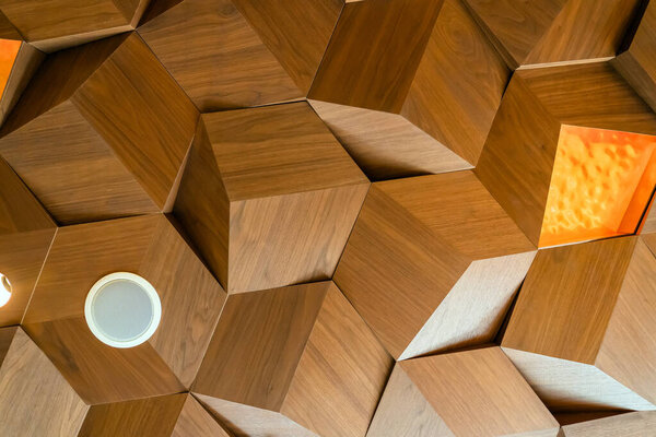Lights and Speakers Drop Ceiling Wooden Texture Tiles. Hexagon Metal Timber Panels. Three Dimensional Cube Shape Decoration. Bottom View.
