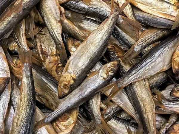 Many smoked fish sprats closeup — Stock Photo, Image