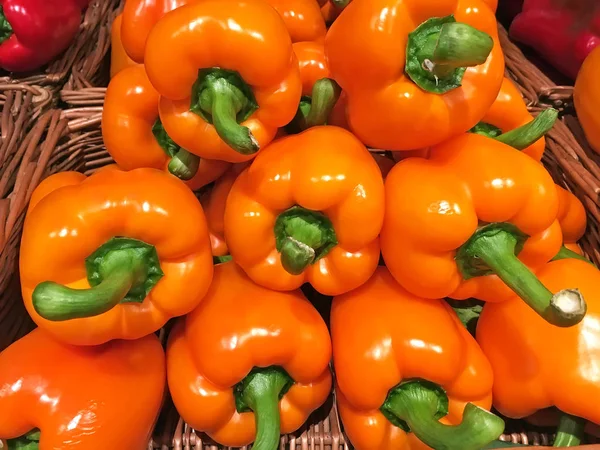 Orange bell pepper in stack