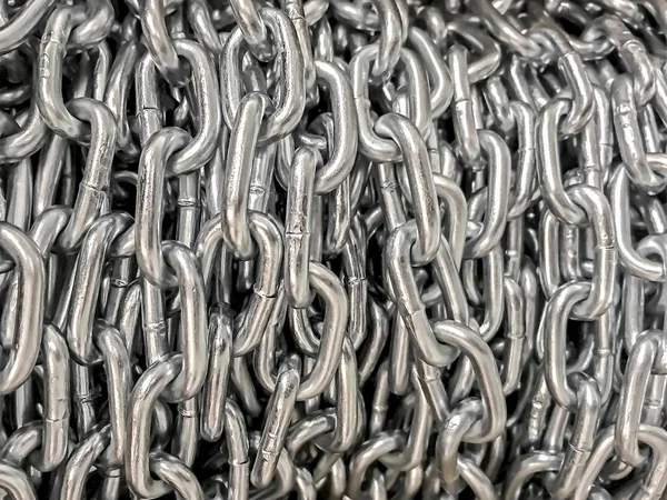 Przemysłowe tło - zbliżenie metalowych łańcuchów — Zdjęcie stockowe