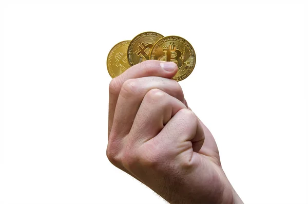 Tre guldmynt av Bitcoin i hand — Stockfoto