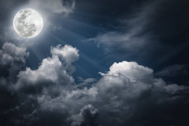 Nighttime sky with clouds, bright full moon would make a great background. clipart