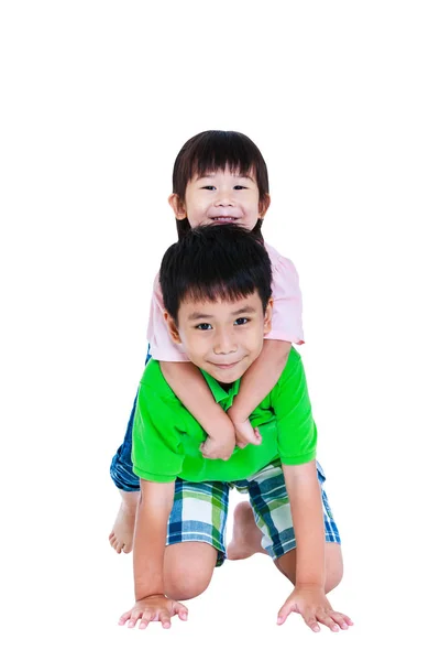 Asian brother with his sister on piggyback ride smiling happy together, isolated on white background. — Stock Photo, Image