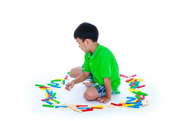 Asian child playing toy wood blocks, isolated on white background — Stock Photo, Image