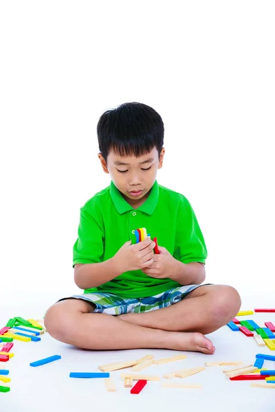 Asian child playing toy wood blocks, isolated on white background — Stock Photo, Image