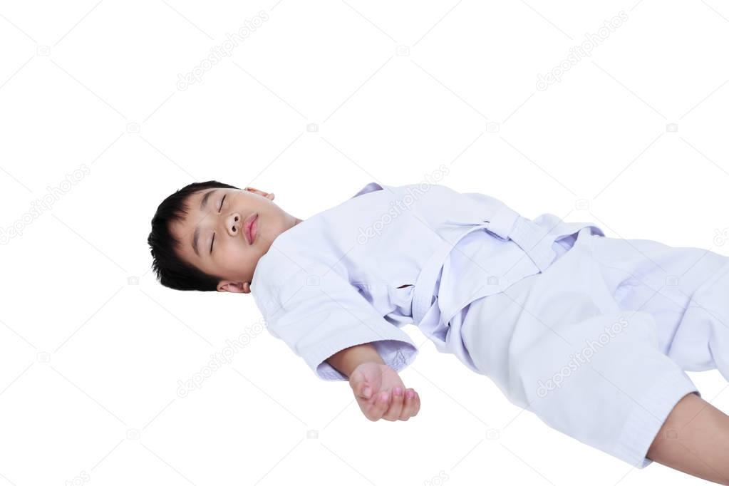 Asian child athletes taekwondo lying down unconsciously on floor