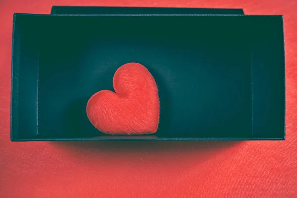 Red heart-shaped in a black gift box for a Valentine's day. — Stock Photo, Image