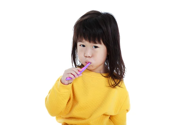 Closeup cute asian girl with a toothbrush in hand going to brush — Stock Photo, Image