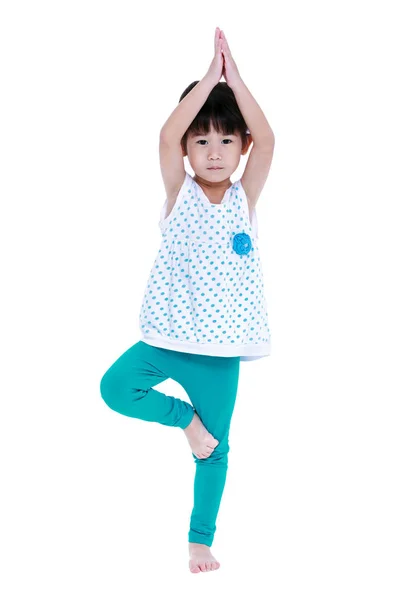Asian pretty girl is doing yoga exercises. Isolated on white background. — Stock Photo, Image