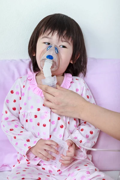 Asian girl having respiratory illness helped by health professio — Stock Photo, Image