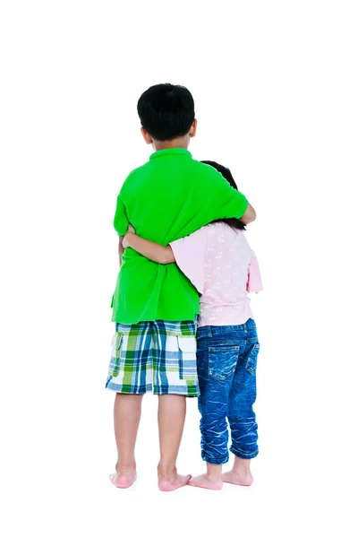 Back view of asian brother put one's arm around sister's shoulder, isolated on white background. — Stock Photo, Image