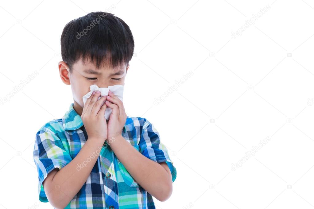 Asian boy using tissue to wipe snot from his nose. Isolated on w