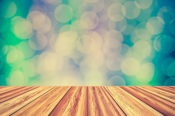 Wooden board empty table top with blurred bokeh background. — Stock Photo, Image