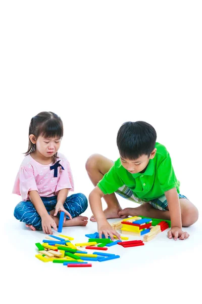Asian children playing toy wood blocks, isolated on white background — Stock Photo, Image