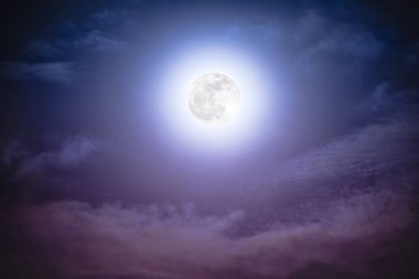 Nighttime sky with clouds and bright full moon with shiny.   clipart