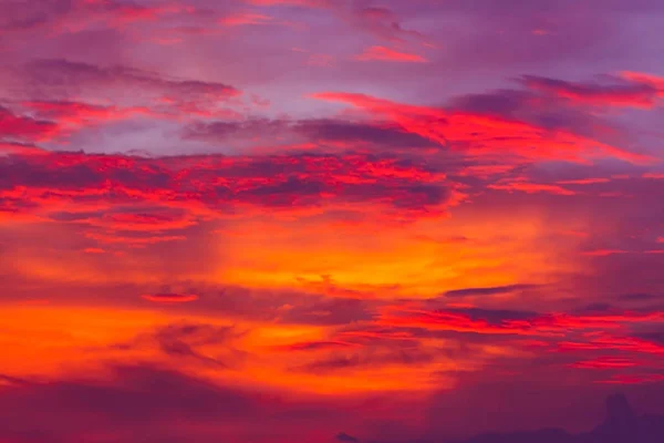 Nature background. Red sky at night and clouds. Beautiful and colorful sunset or sunrise time.