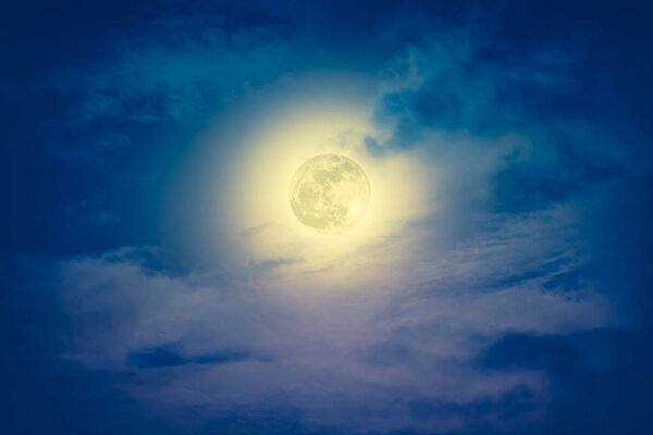 Background of nighttime sky with cloud and full moon with shiny. Natural beauty at night. Cross process and vintage effect tone. The moon were NOT furnished by NASA.