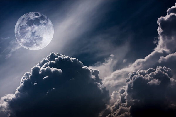 Super moon. Attractive photo of background night sky with cloudy and bright full moon. Nightly sky with beautiful full moon. Vintage tone effect. The moon were NOT furnished by NASA.