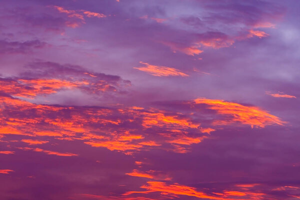 Nature background. Red sky at night and clouds. Beautiful and colorful sunset 