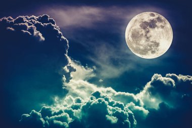 Nighttime sky with clouds and bright full moon with shiny.  Cross process tone. clipart