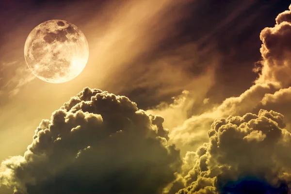 Nighttime sky with clouds and bright full moon with shiny. Sepia tone.