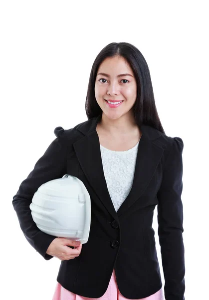 Glada asiatiska affärskvinna leende och hålla vita byggarbetarhjälm. — Stockfoto