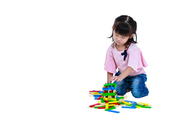 Crying asian child playing toys and seem unhappy. Isolated on white background. — Stock Photo, Image