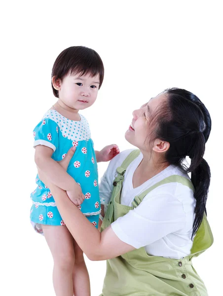 Happy asian mother carrying her daughter. Isolated on white background. — Stock Photo, Image