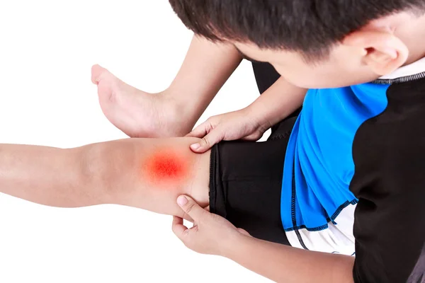 Sports injure. Asian child cyclist injured at thigh. Isolated on white background. — Stock Photo, Image