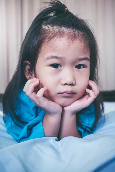 Unhappy illness asian child admitted in hospital. Vintage tone. — Stock Photo, Image