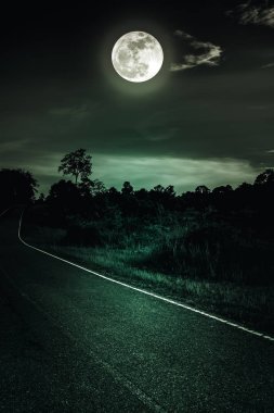 Dark sky with full moon and roadway through suburban zone. Serenity nature background. clipart