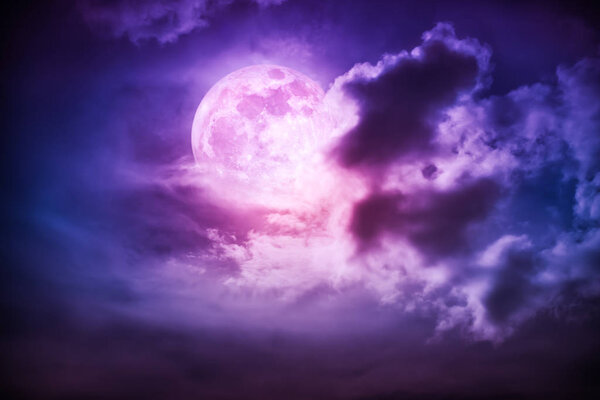Attractive photo of cloudscape at nighttime. Night landscape of dark purple sky with bright full moon behind clouds, serenity nature background. The moon taken with my own camera.
