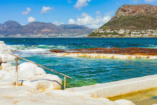 Tide pool on a rough coastline, Seaside rock pool in Cape Town South Africa