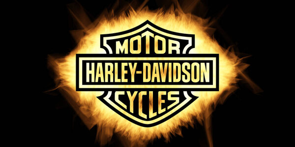 Yellow Burning Flames Effect on Harley Davidson Logo against bla