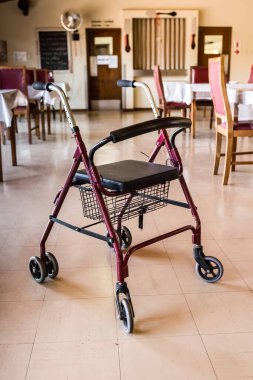 Old Medic Rollator 4 wheel Aluminum With Hand Brake in a old age nursing home clipart