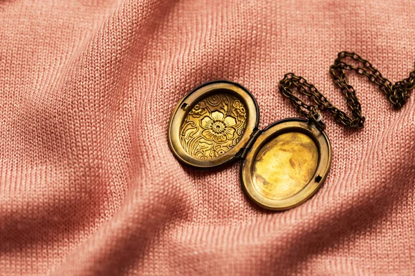 Vintage Grandma Bronze Locket Pink Fabric Background — Stock Photo, Image