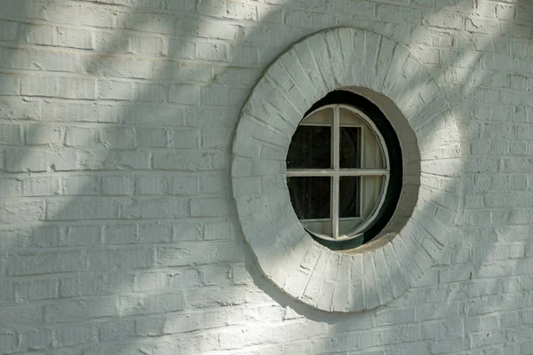 Artistic round window to the street