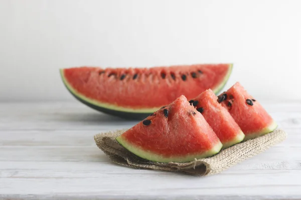 Stock Photo Fresh sliced watermelon wooden background — Stock Photo, Image