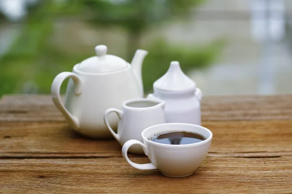 Stock Photo - cups of coffee and milk on woodden table — Stock Photo, Image